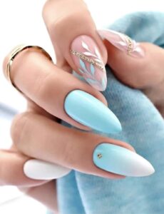 acrylic nails decorated with floral prints and gems